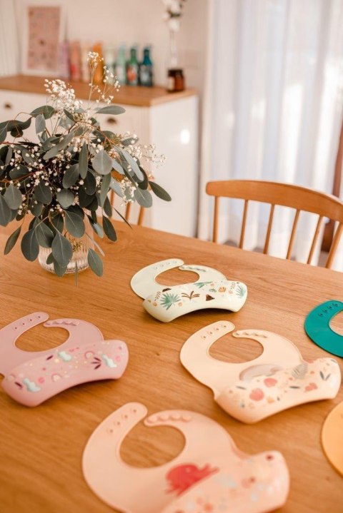 Śliniak silikonowy z kieszonką Dinozaur SASSI