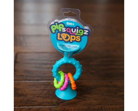 Bobo Przyssawka Grzechotka gryzak PipSquigz Looms Niebieska Fat Brain Toy Qelements 6m+